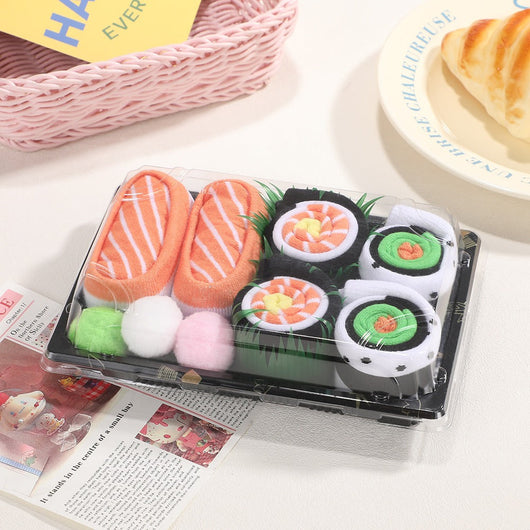 Chaussettes sushi Velora Makisu dans leur boîte à emporter